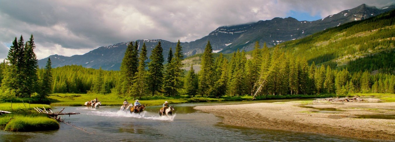 AB, Kananaskis Country riders in river, credit Travel Alberta, Sean Thonson